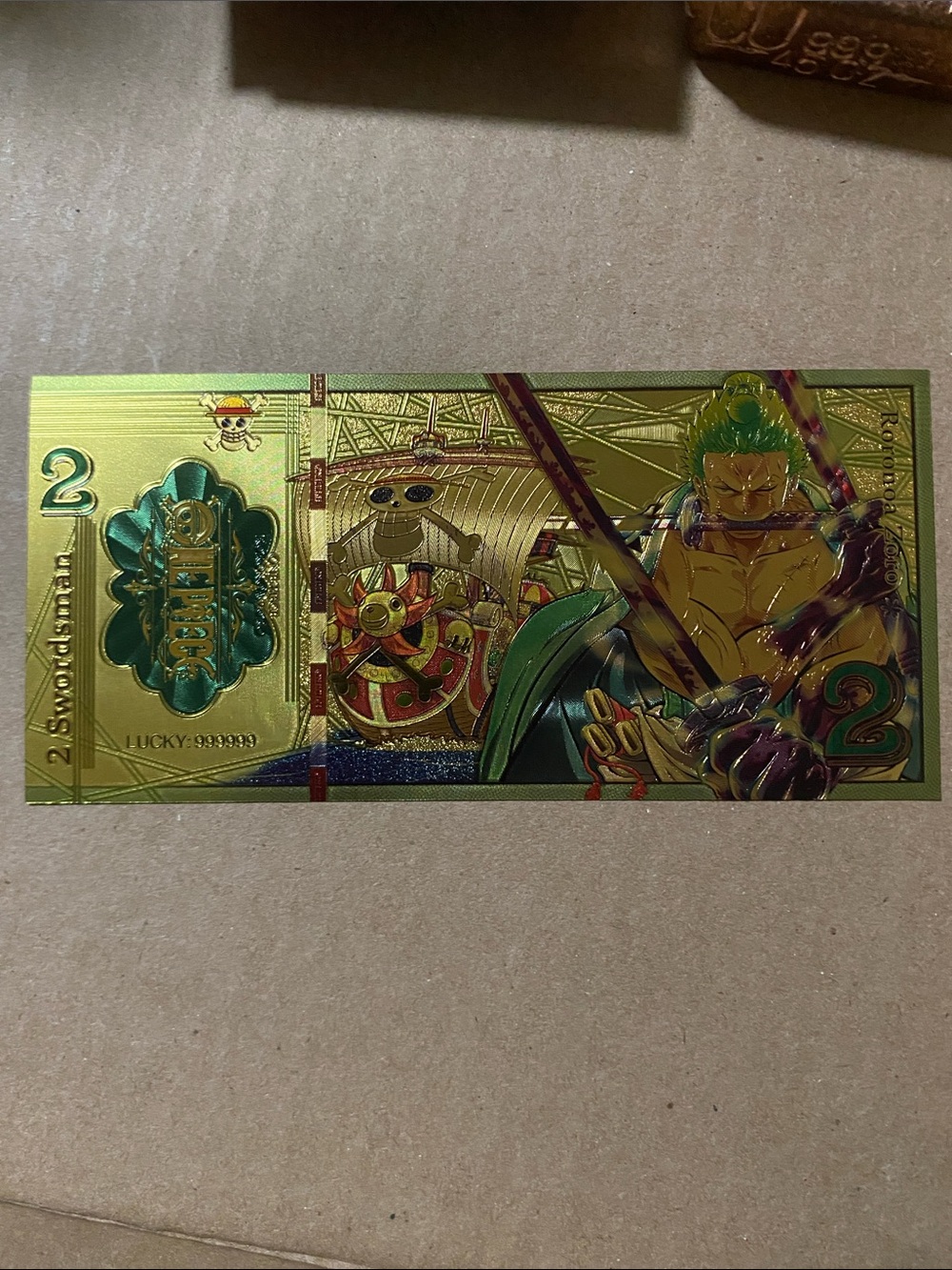 Gold Foil Anime Collectible Note with Green Accents. Ft swordsman